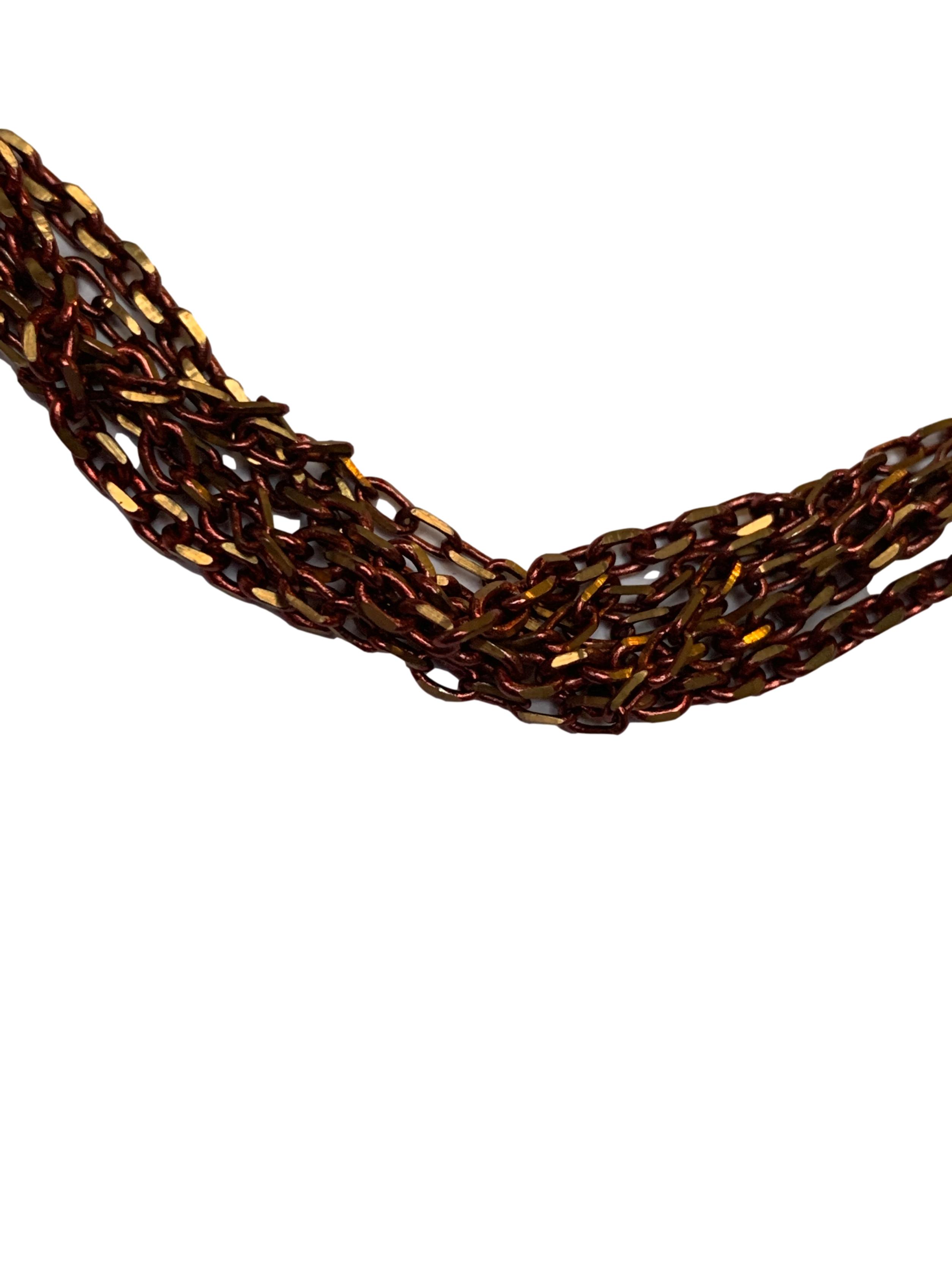 Collar de 6 cadenas en tonos cobre y dorado. Largo 60cm
