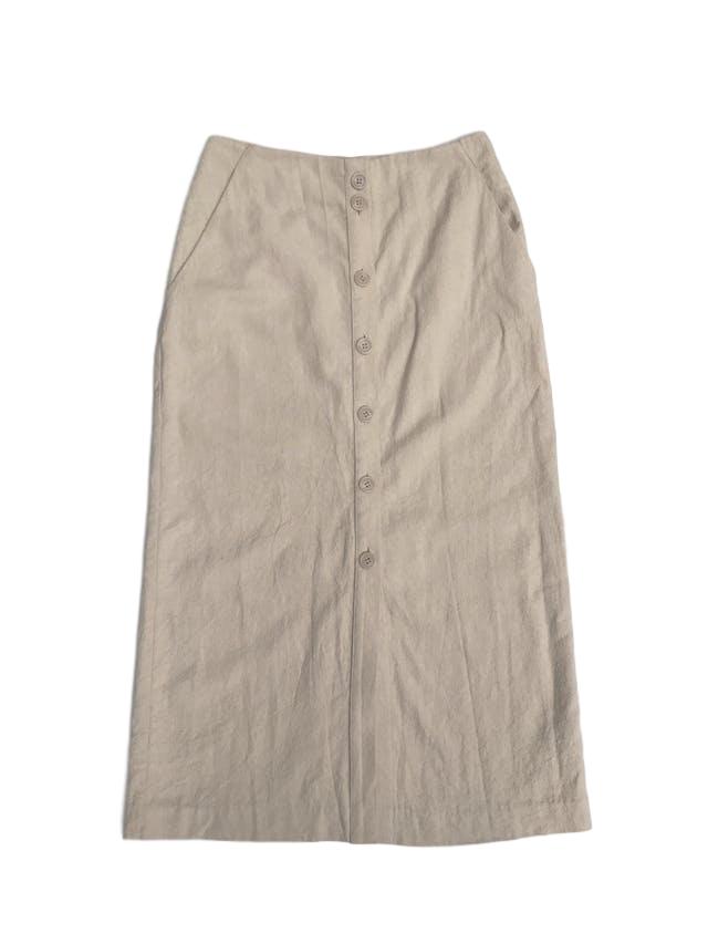 Falda larga H&M 54% lino 46% algodón crema, bolsillos laterales, fila de botones al centro y aberturas en la basta. Precio original S/ 170 Largo 87cm
Talla S