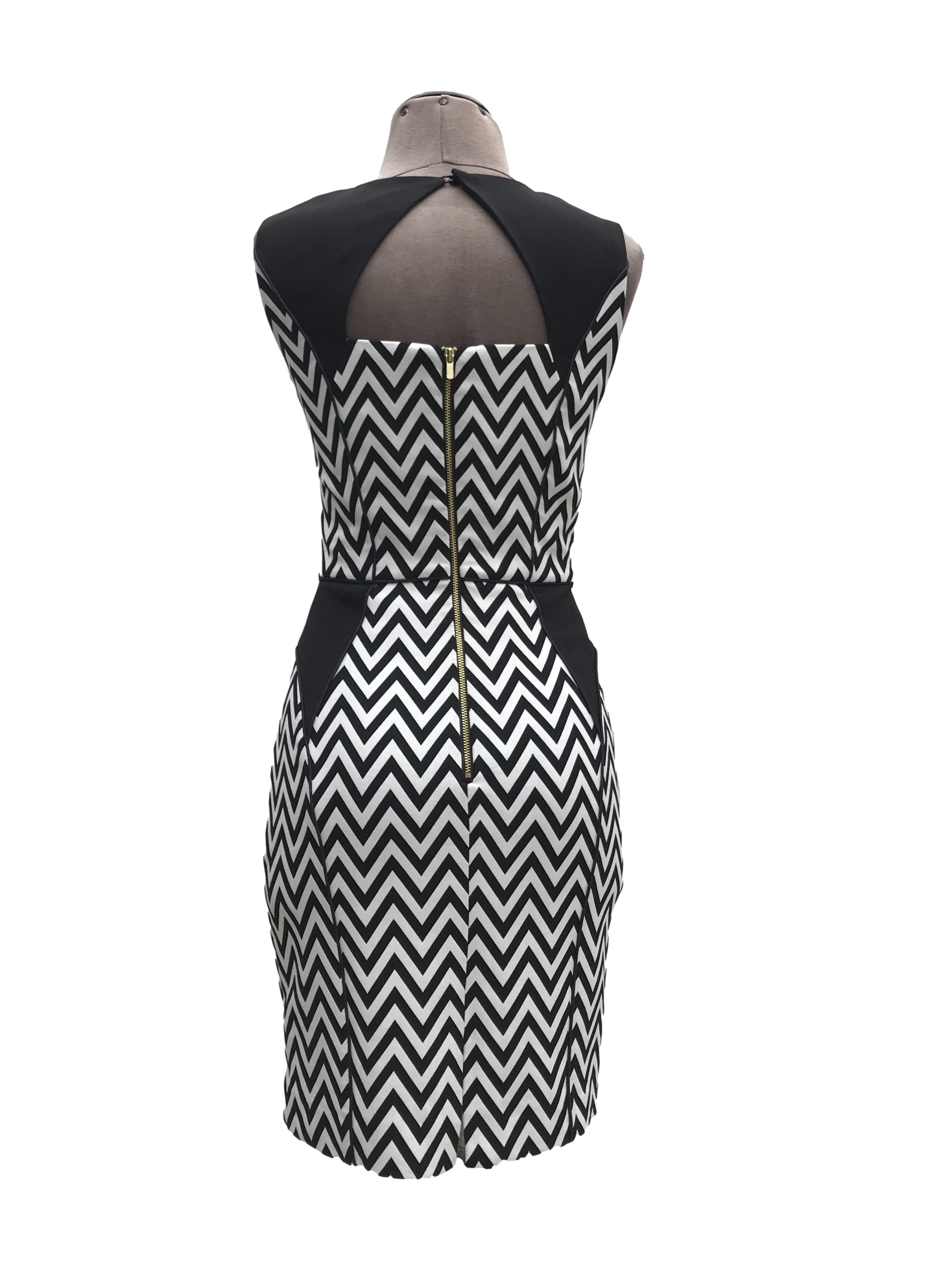 Vestido H&M estampado zigzag blanco y negro, forrado, ribetes negros, cierre y escote posterior. Largo 87cm Precio originsl S/ 130