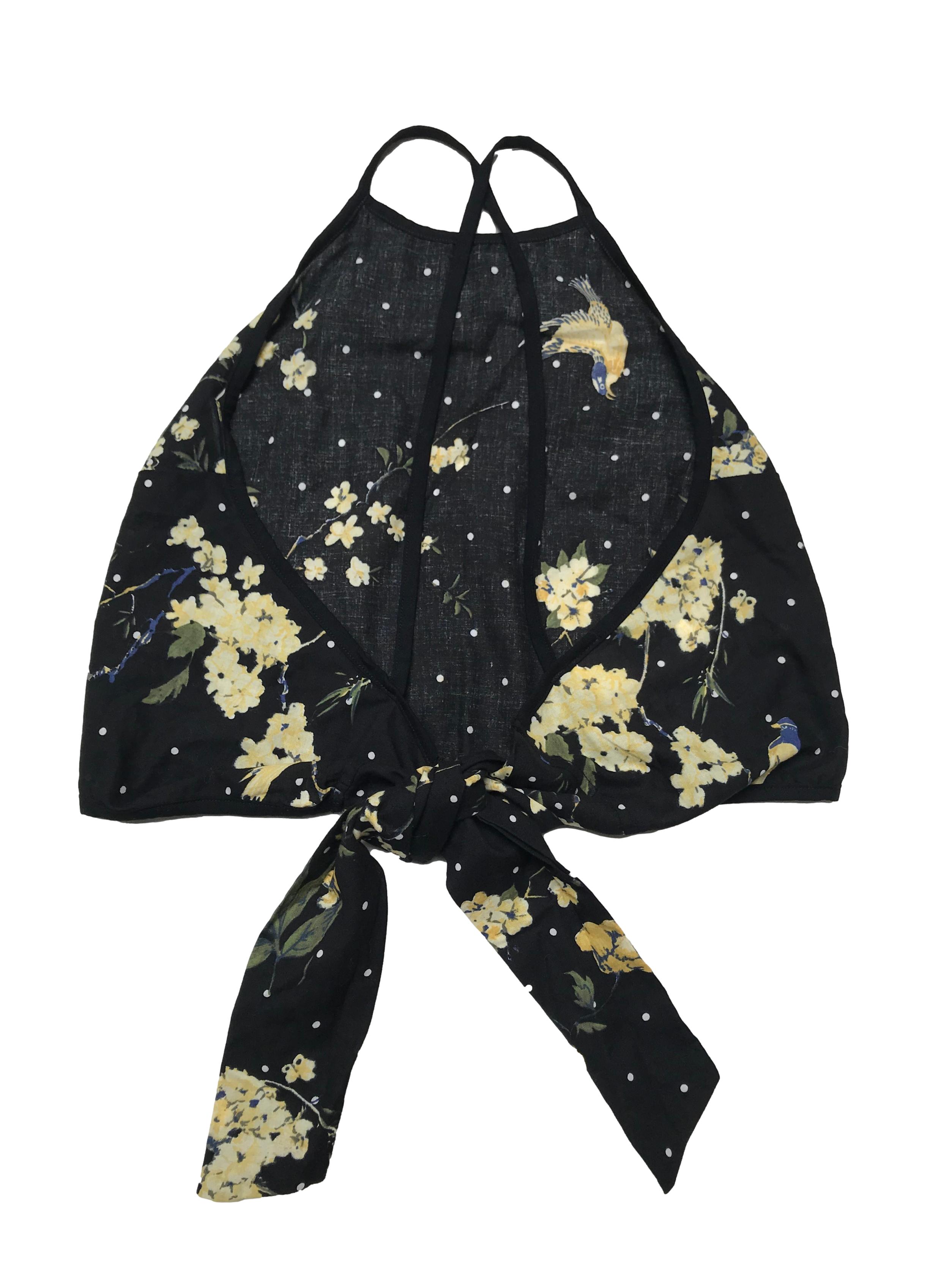 Top Ibella Ama negro con estampado de lunares y flores, tiritas cruzadas y se amarra en la espalda. Precio orignal S/ 80