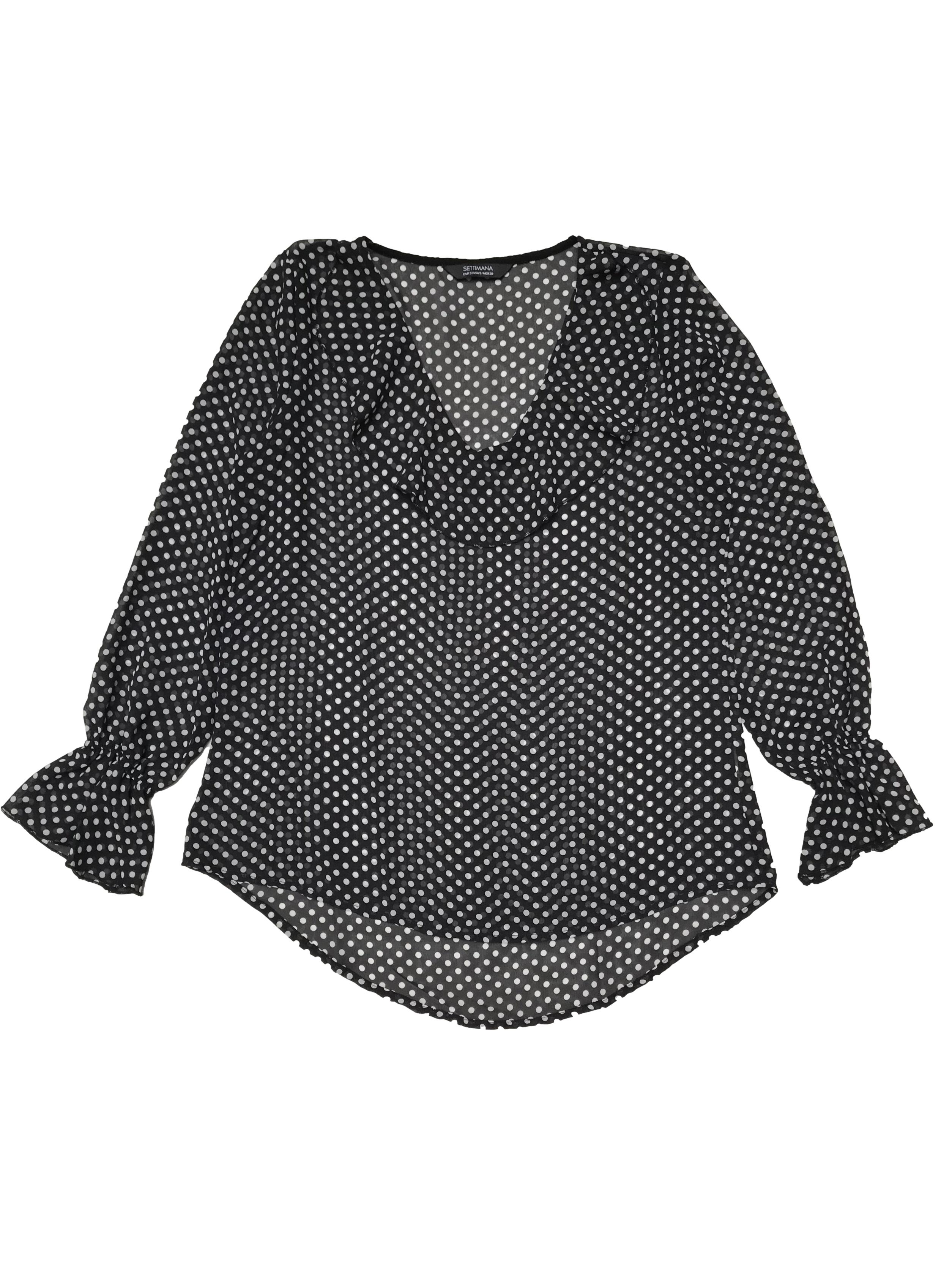 Blusa Settimana de gasa negra con lunares blancos, cuello en V con volante, elástico en los puños. Ancho 98cm Largo 60-70cm
