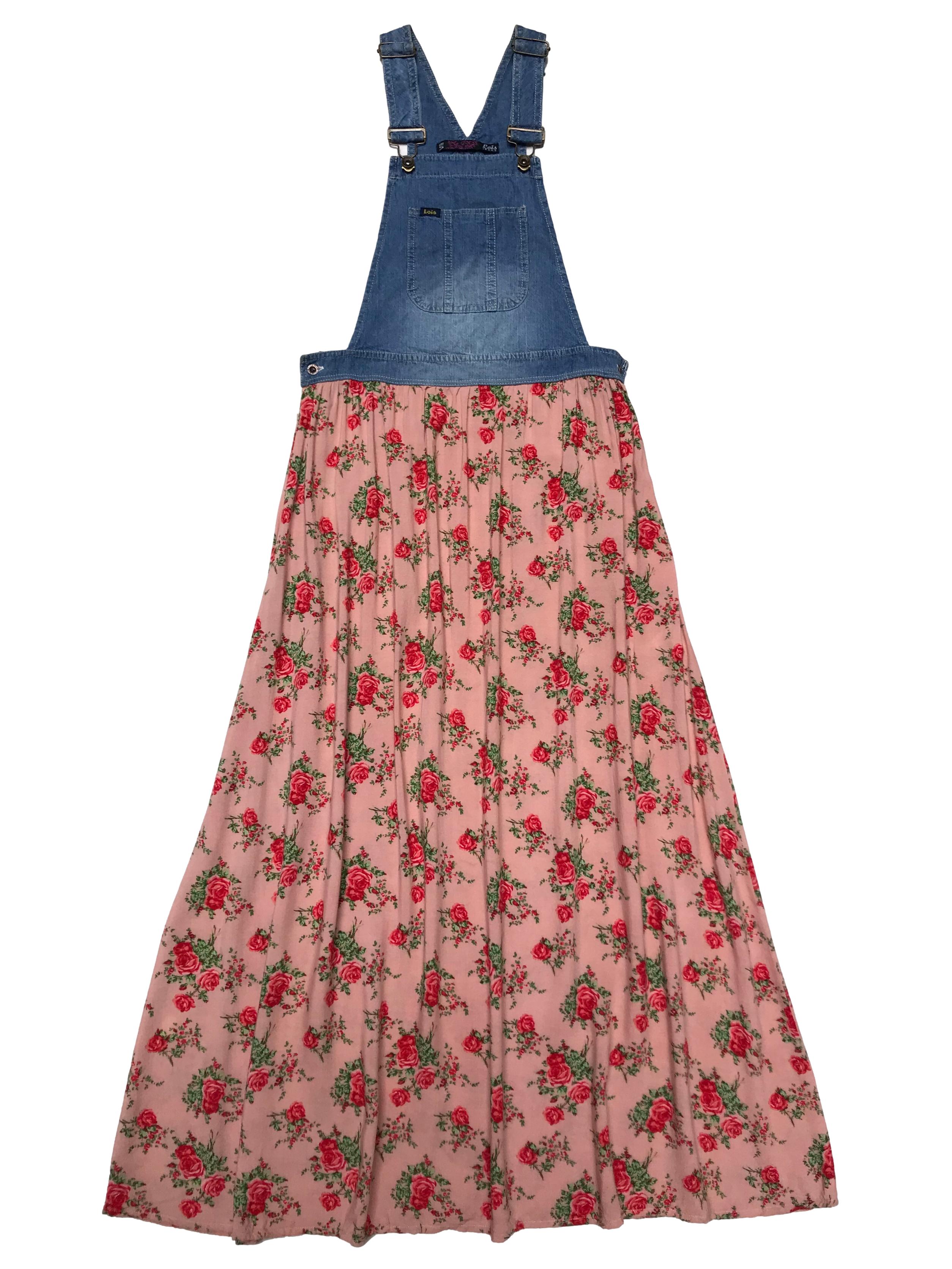 Jumper jean con tiras regulables y broches metálicos, tiene falda larga de tela con estampados de rosas y cierre invisible lateral. Cintura 70cm. Largo 114cm desde el pecho